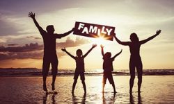 Happy family jumping on the beach at the sunset time. Happy family jumping on the beach at the sunset time.