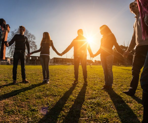 Multiracial Young People Holding Hands in a Circle Multiracial Young People Holding Hands in a Circle